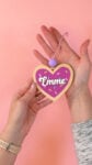 Hand displaying finished Valentine heart "cookie" ornament