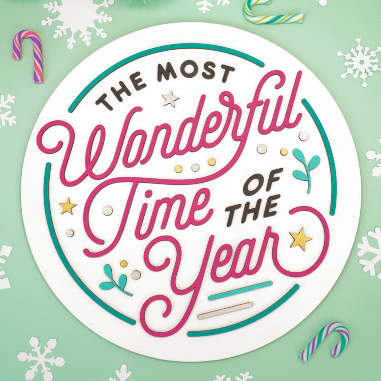 "The Most Wonderful Time of the Year" laser-cut wood sign round on mint green background