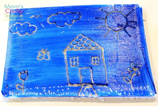 styrofoam with house image painted blue 