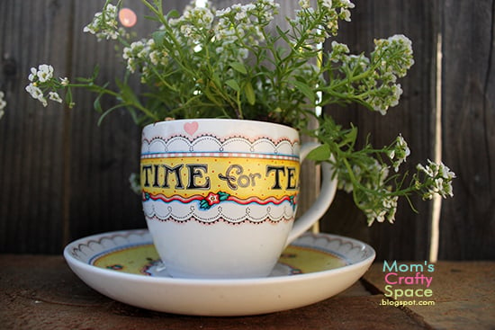 tea cup with plant growing out of it 