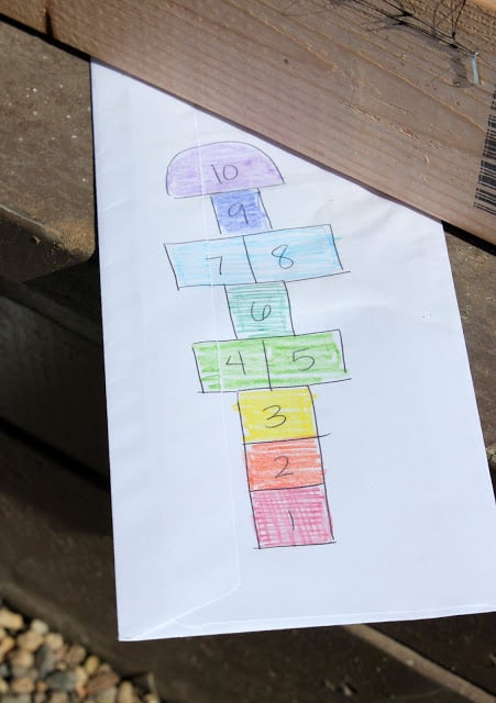 homemade hopscotch from pavers drawn on paper 