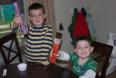 little kids playing with diy rainsticks 