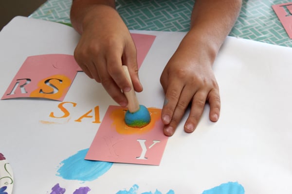kids using stencils for decorate kite