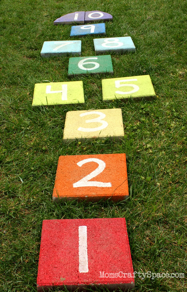 hopscotch tiles laid out in yard