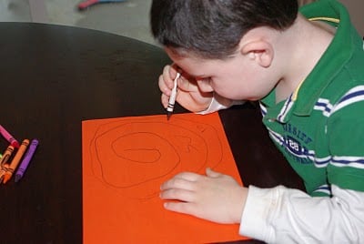 kid drawing on paper