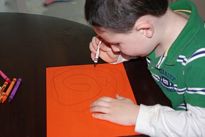 kid drawing on paper