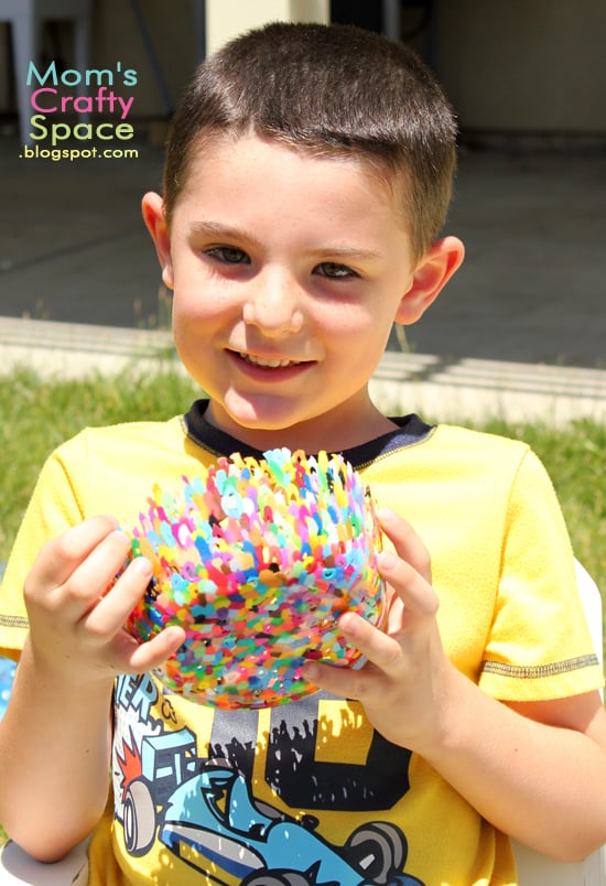 child holding diy perler bead bowl