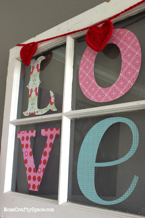 letters spelling LOVE in window pane 