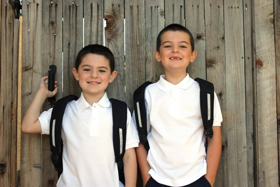 adorable young boys posing for school picture outside