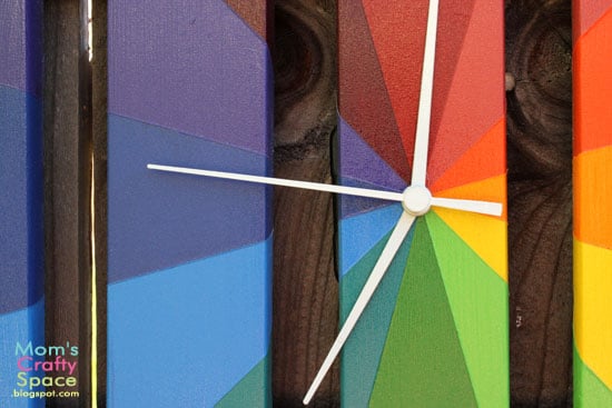 white hands on colorful clock