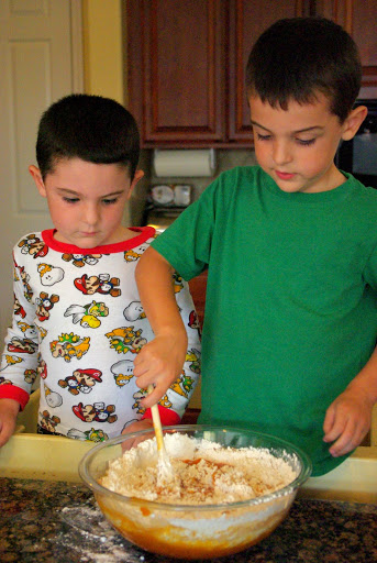 two brothers mixing up banana bread recipe