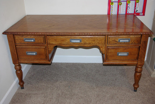 desk before makeover in rustic wood color 
