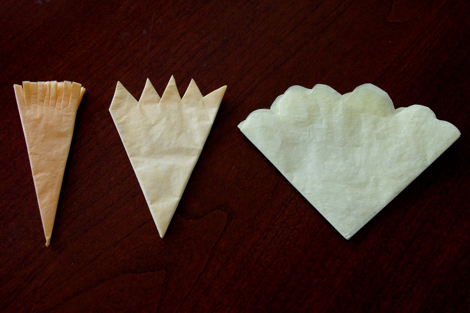 coffee filters folded and cut into various shapes and patterns
