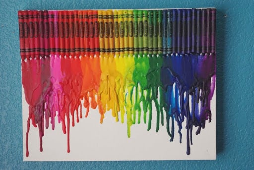 melted crayon art project in rainbow colors