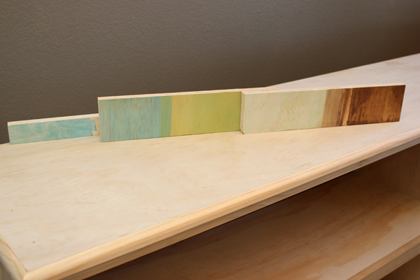 color swatches laid out on book shelf