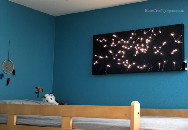 constellation canvas lit up in kids bedroom