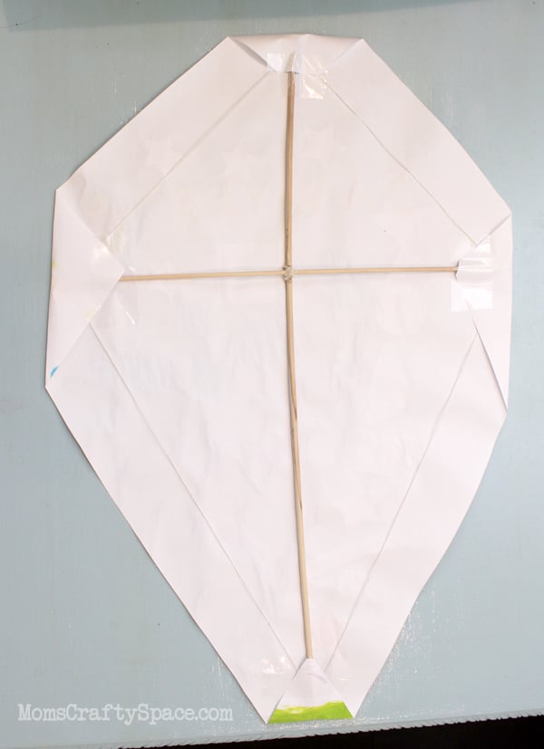 kite frame with paper folded over edges 