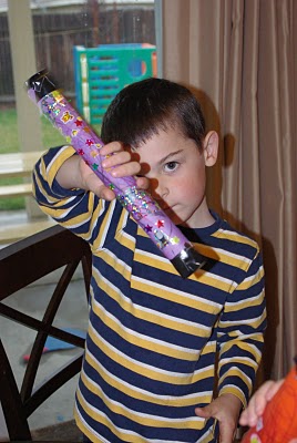 little kid enjoying homemade rainstick