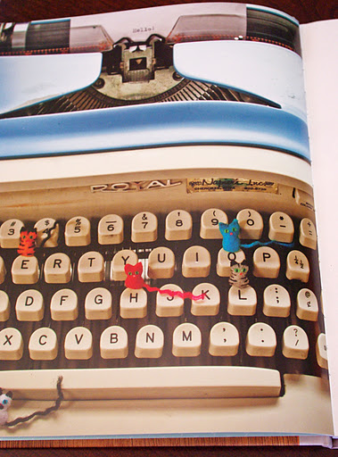small cat toys inside of a type writer