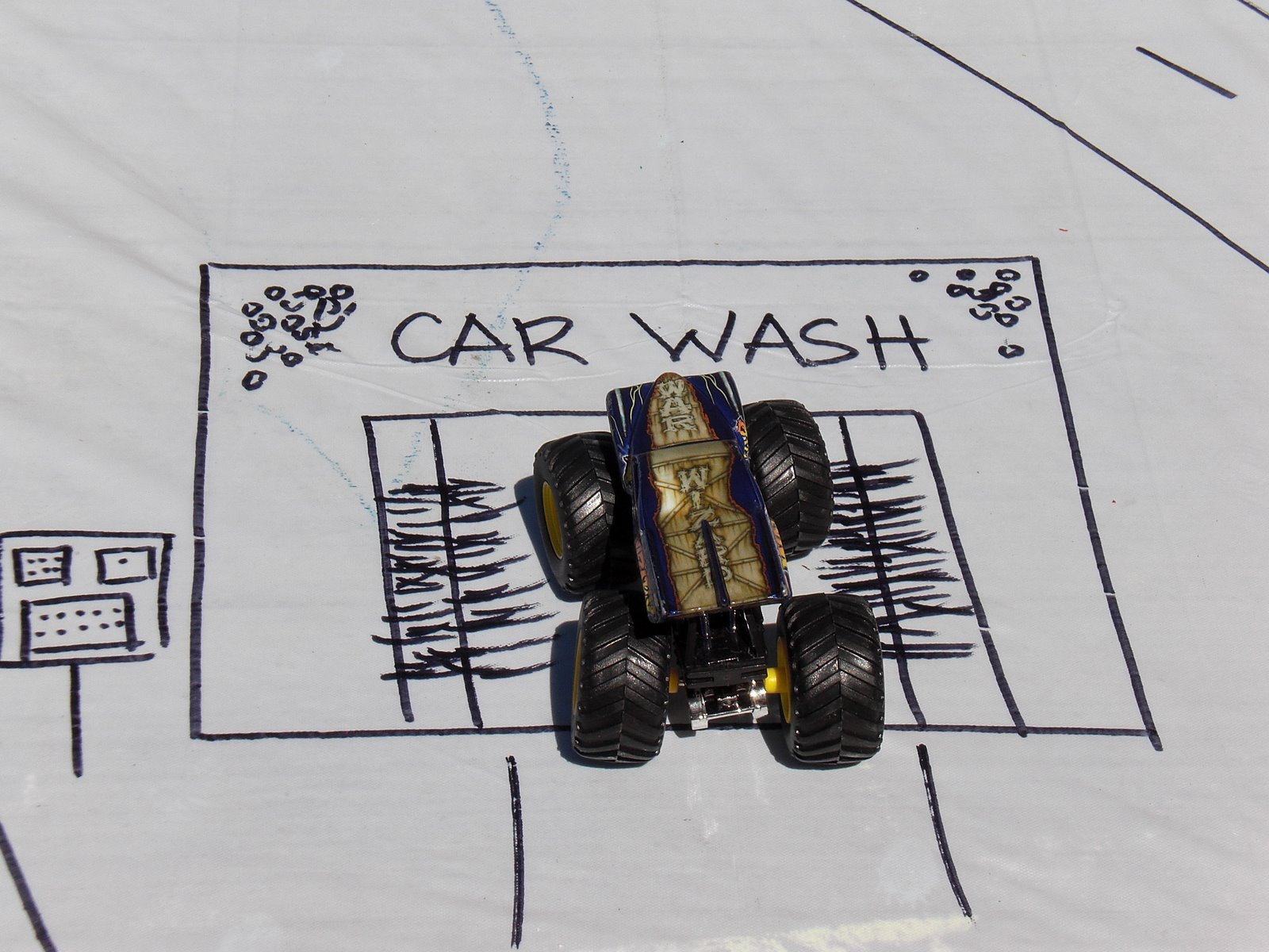toy car parked at drawn car wash 