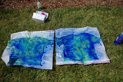 blue batik shirts painted on grass 