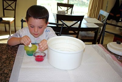 small boy preparing firework art supplies