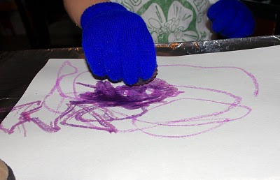 kids painting with crayons art activity 