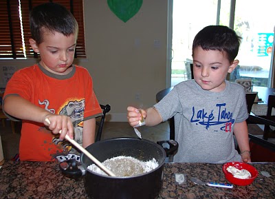 kids making a permanent sand castle 