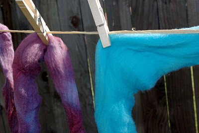 wool clipped to clothesline with a clothespin 