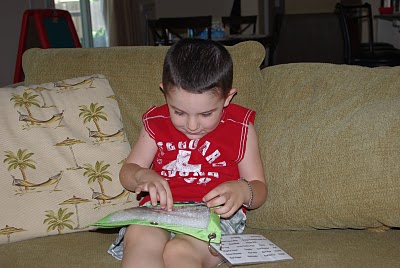 small boy pointing out his finds in fun i spy game for kids