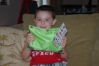 small boy smiling while playing game