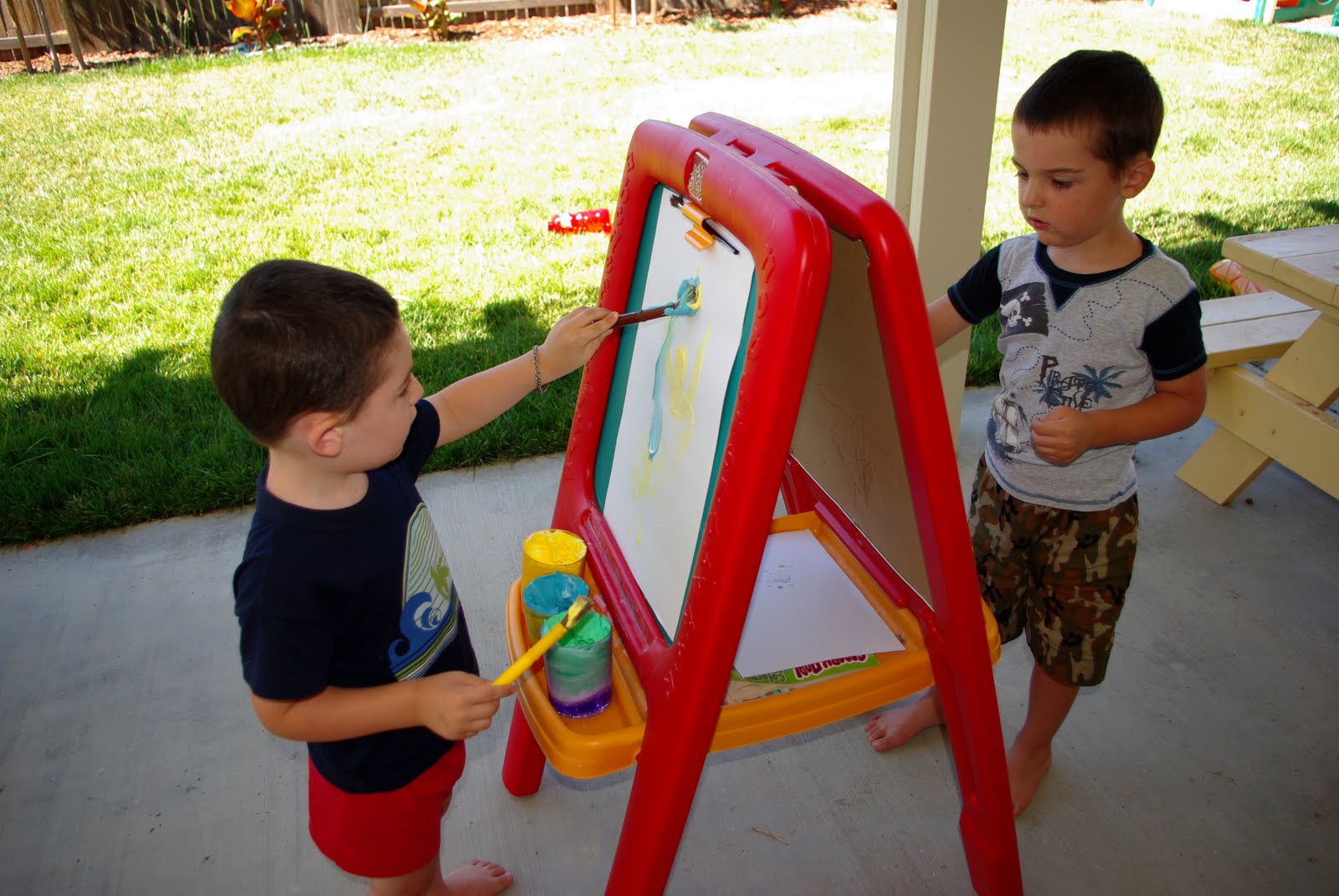 kids painting at kid easel 