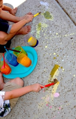 kids painting with homemade chalk paint