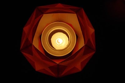 star lantern with candle lit inside