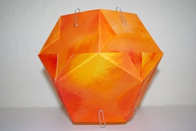 star lantern constructed with paper clips hanging off each side