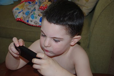 child holding device in hands