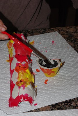 painting egg carton dragon red and yellow